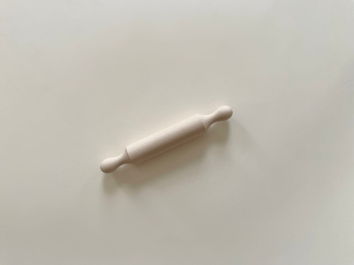 Mini wooden rolling pin designed for children – lightweight, smooth finish, ideal for play dough activities and enhancing fine motor skills.